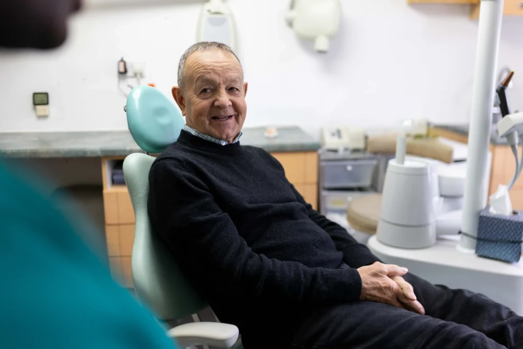 Happy senior man at a dental appointment.